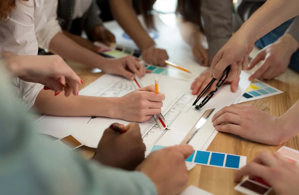 Planning session with drawings on a table